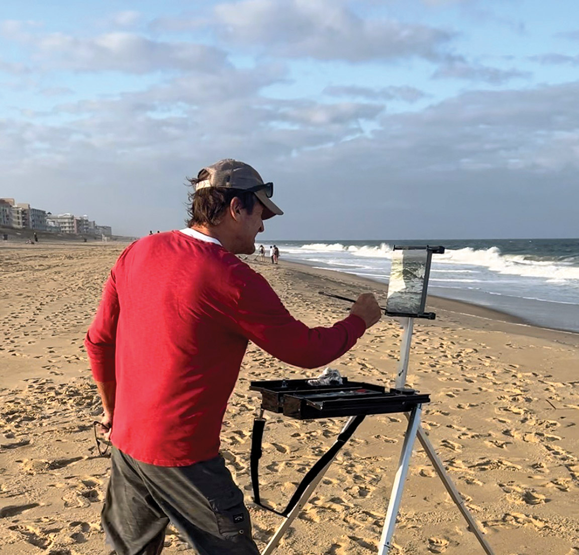 Artist Painting at Seashore