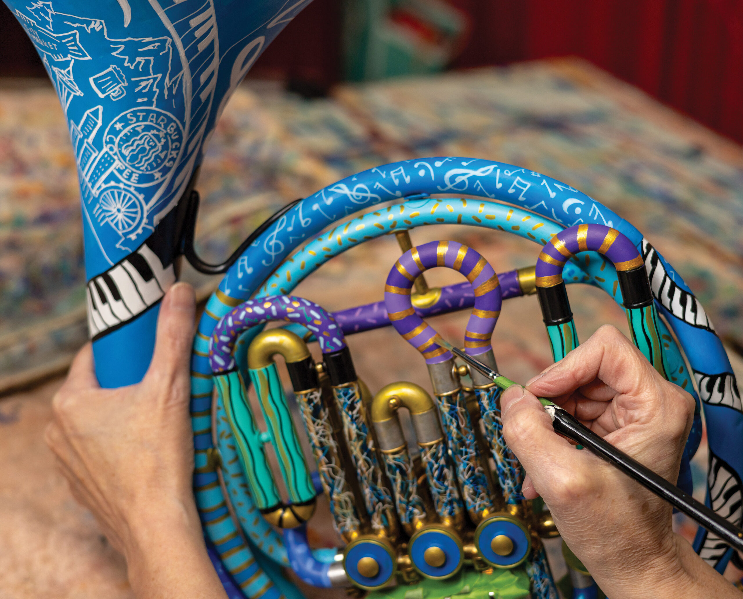 Artist painting musical instrument