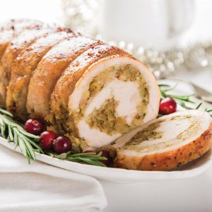 stuffed turkey breast roll. White background. Selective focus