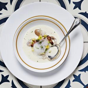 EASTON, MD - JANUARY 21: Smoked oyster soup with local wild diver oysters lightly smoked with cherrywood, celery onion, bacon, Yukon gold potato, chives and warm milk foam at Bas Rouge photographed in Easton, MD on January 21, 2021. (Photo by Deb Lindsey for The Washington Post).