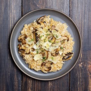 Risotto with mushrooms, cheese and thyme. Vegetarian food. Italian food