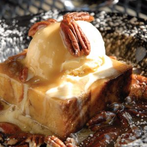 Bread Pudding with Ice Cream, Pecans and Powdered Sugar
